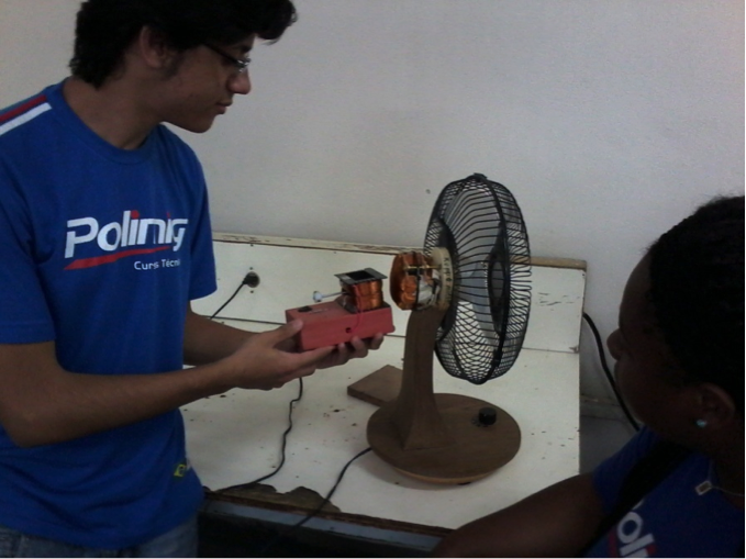 Students from POLIMIG , Diego Phillipe and Gisele Caetano experimenting with the Keppe Motor -Novembro 2013